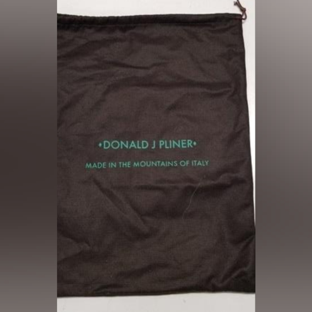 Donald J Planner dust bag.